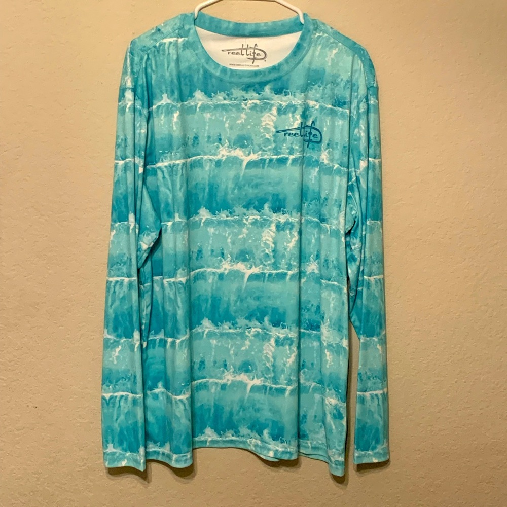 This is a blue reel life fishing shirt. At a size XL it is very durable/comfy.